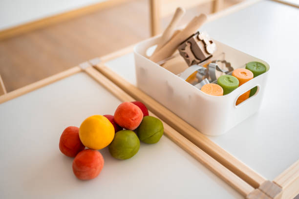 Colorful homemade dough as plasticine for playing. Sensory development and experiences, themed activities with children, fine motor skills development