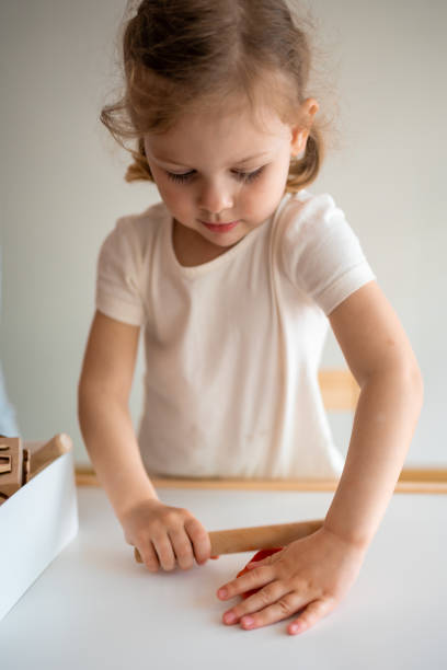 istock A little girl playing with plasticine. Sensory development and experiences, themed activities with children, fine motor skills development 1488427900