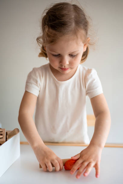 istock A little girl playing with plasticine. Sensory development and experiences, themed activities with children, fine motor skills development 1488427907