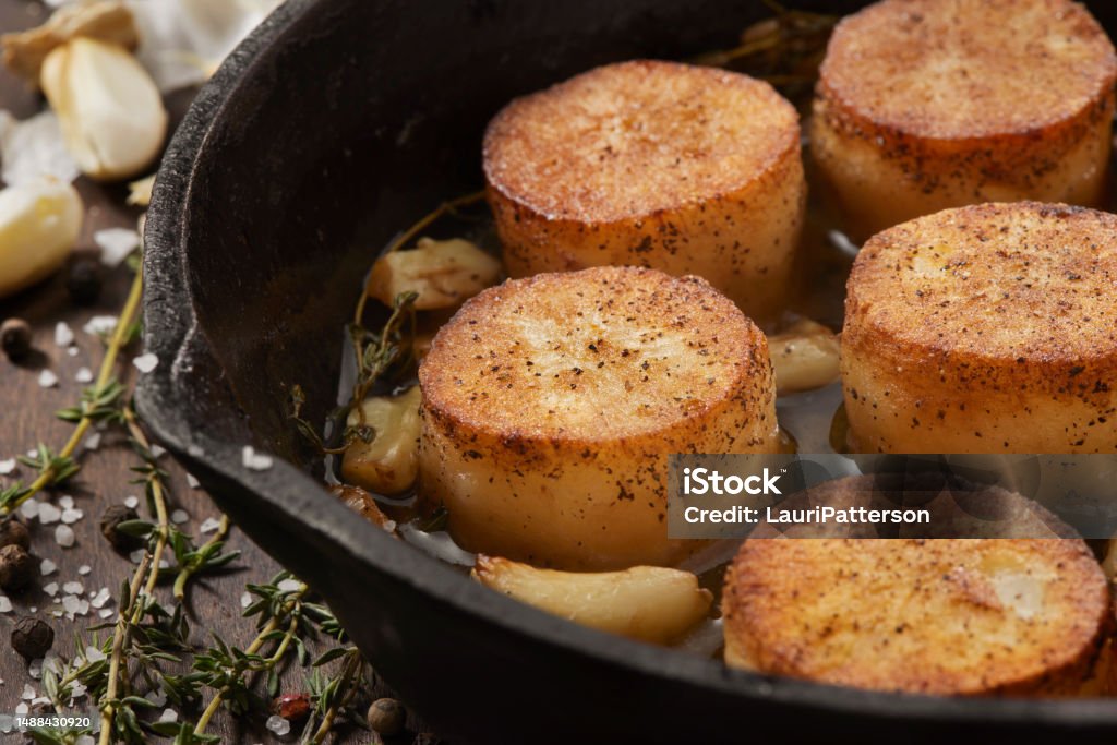 Fondant AKA Melting Potatoes in a Garlic and Thyme Butter Appetizer Stock Photo