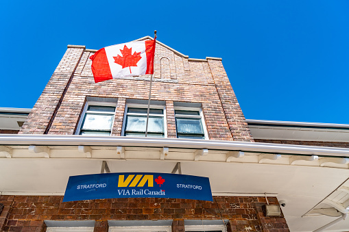 Stratford, Canada - April 2, 2023: The view of train station and VIA Rail Canada Logo, Stratford, Canada.