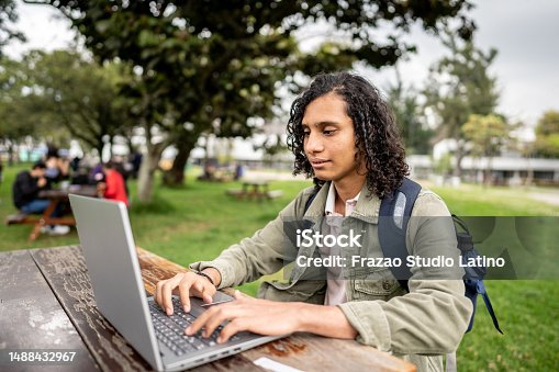 istock Young student studying using a laptop on the university campus 1488432967