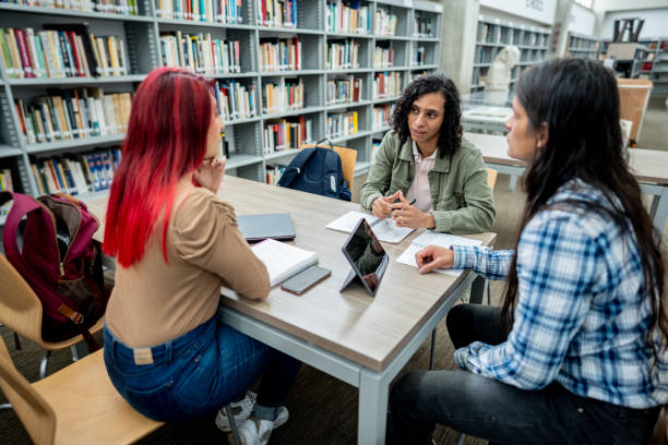 istock Student friends studying in the library at the university 1488433058