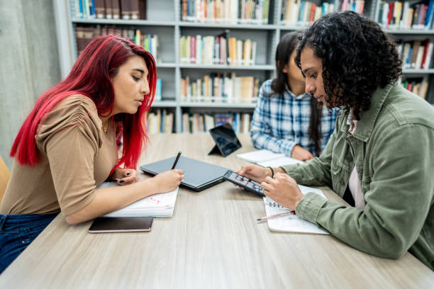 istock Student friends studying in the library at the university 1488433093
