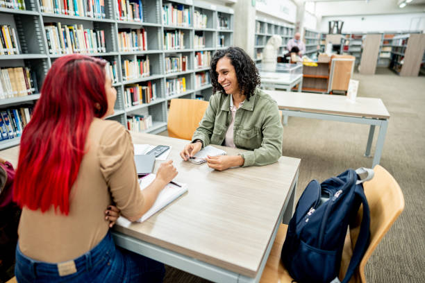 istock Student friends studying on library in the university 1488433227