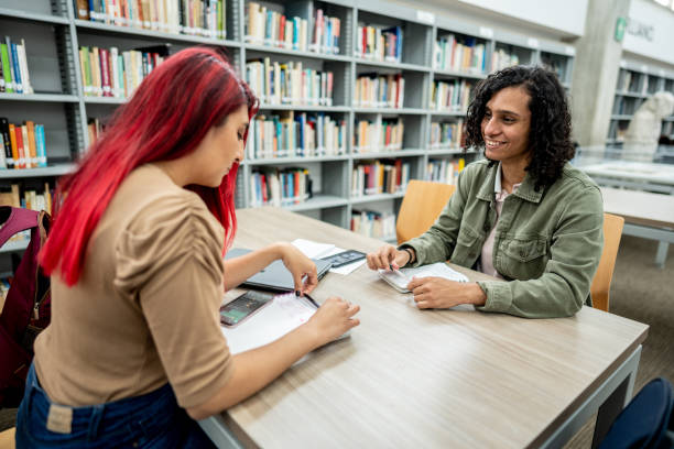 istock Student friends studying on library in the university 1488433742