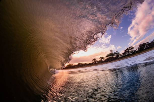 istock the waves roll around in Barreling at sunset 1488434325
