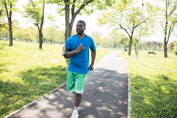 istock Happy young man is exercising outdoors 1488438130