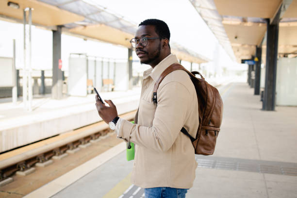 istock Young tourist is waiting for a train 1488438465