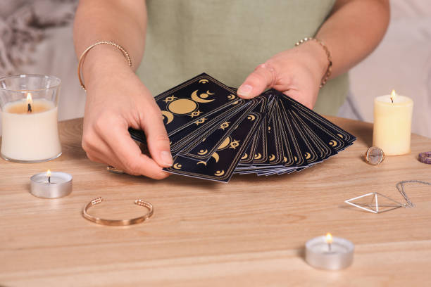 istock Soothsayer predicting future with tarot cards at table indoors, closeup 1488438524