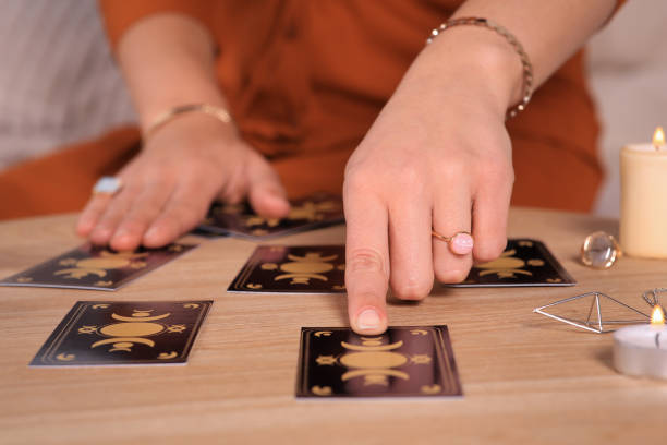 istock Soothsayer predicting future with tarot cards at table indoors, closeup 1488438526
