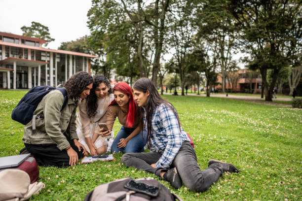 istock Student friends watching something on a mobile phone on the university campus 1488438664