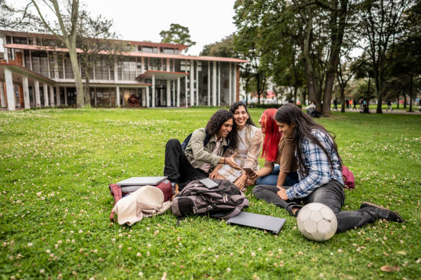 istock Student friends watching something on a mobile phone on the university campus 1488438670