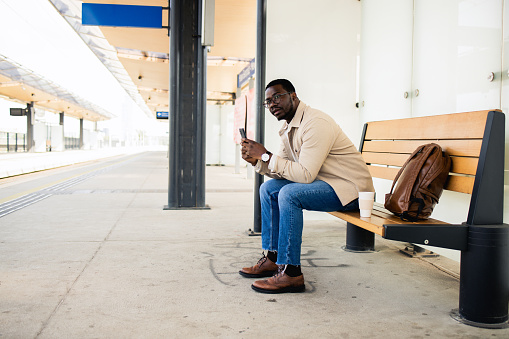 Student is waiting for a train