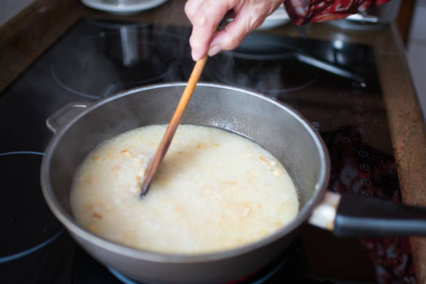 istock Senior woman stirring rice during cooking 1488440275