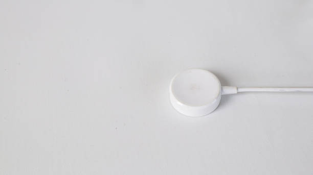 istock smartwatch magnetic charger white color with white background 1488441568