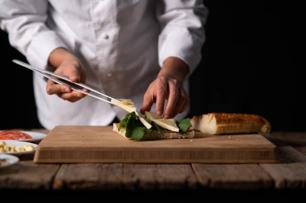 istock A male chef preparing a sandwich 1488442431