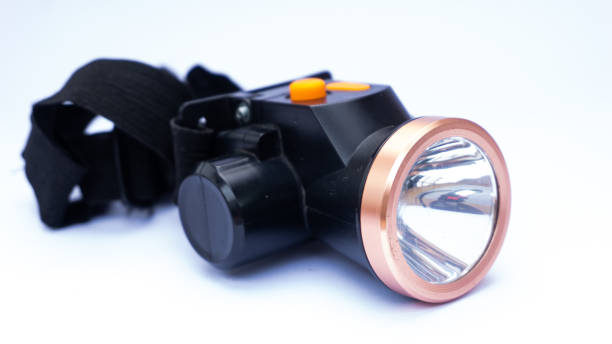 istock A black headlamp with a copper crown and an orange rubber button 1488442433