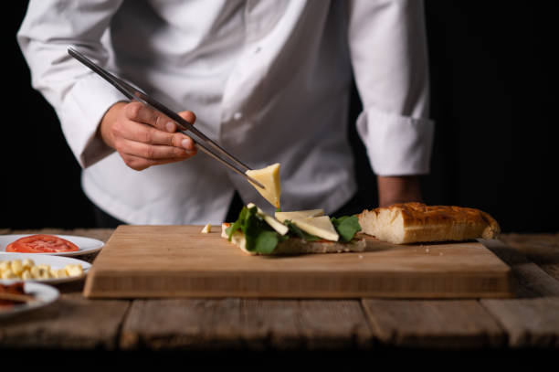 istock A male chef preparing a sandwich 1488442442