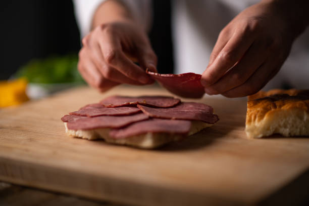 istock A male chef preparing a sandwich 1488442470