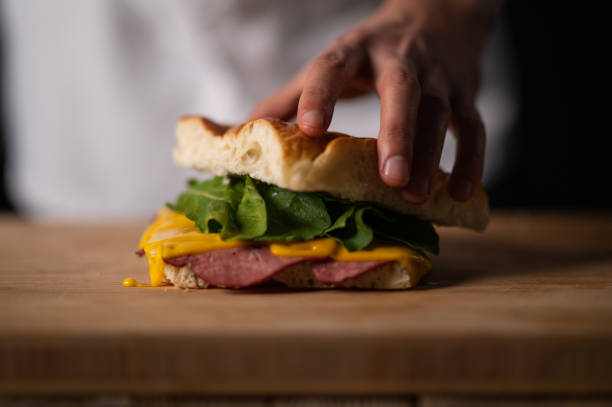 istock A male chef preparing a sandwich 1488442496