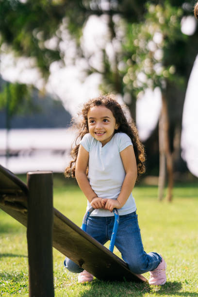 istock Girl having fun on the seesaw 1488442615