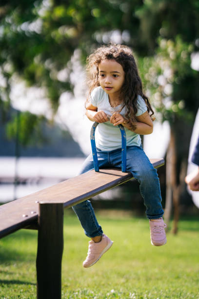 istock Scared girl on seesaw 1488442630