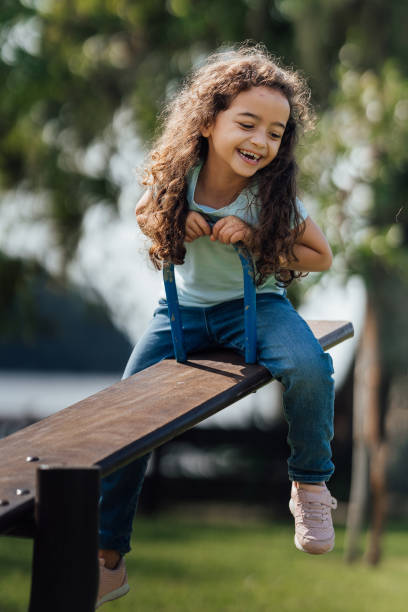 istock Girl having fun on the seesaw 1488442635