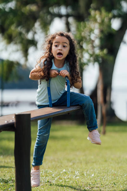 istock Scared girl on seesaw 1488442640