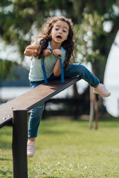 istock Scared girl on seesaw 1488442651