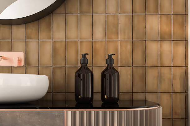 istock Modern bathroom setup with soap dispensers, towels, black-framed mirror, wall lights, and ceramic tiles walls. Ideal for showcasing your products in a stylish and modern setting. 3d rendering 1488444075
