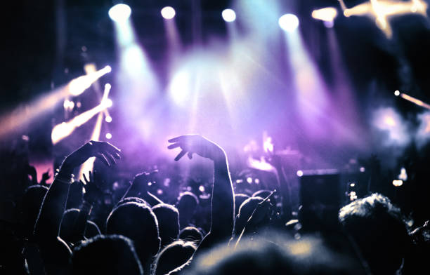 istock Large group of people at a concert party. 1488444607
