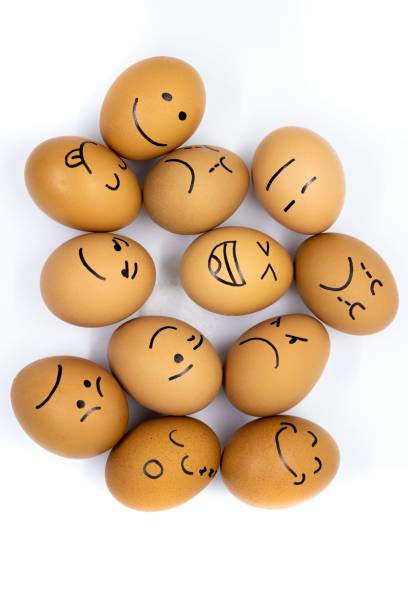 istock a group of eggs with the faces of people drawn on them 1488444692