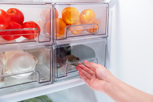 Open fridge of food items
