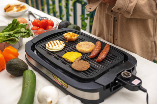 istock Cooking and bbqing burgers outside 1488445005