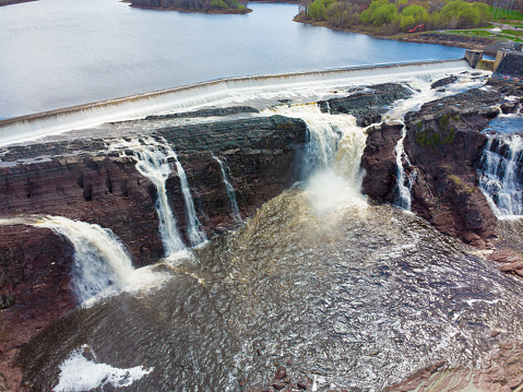 Aerial view of Chaudiere waterfalls and dam on the South shore of Quebec city during springtime day.