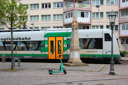 Zwickau, Germany - May 5, 2023: Vogtland regional train RB1 at Zwickau Zentrum station in the center of the city, standing at the combined train-tram platform.