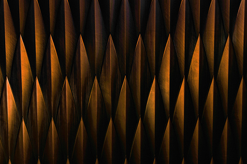 Abstract texture of rhomboid-shaped copper-colored steel sheets. Backgrounds and textures. 3d render.