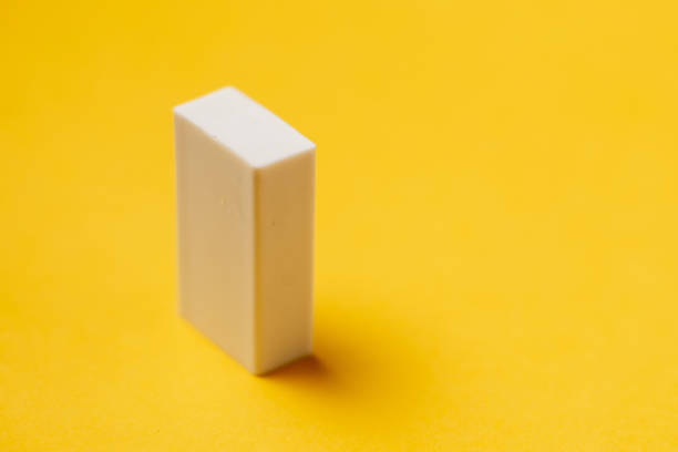 istock White eraser on a yellow background. Stationery for school. 1488454142