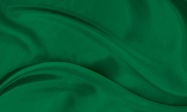 istock Black green satin dark fabric texture luxurious shiny that is abstract silk cloth background with patterns soft waves blur beautiful. 1488455001