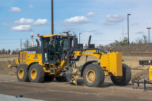 Calgary, Alberta, Canada. May 7, 2023. A Motor Grader 772 GP on a construction site.