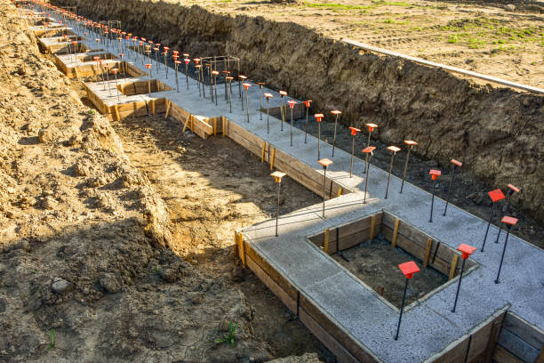 istock Concrete footings in place for new building. 1488456380