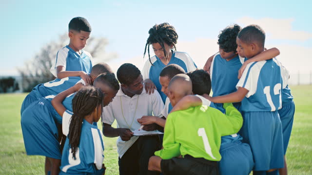 Children, tactics and sports with a coach talking to his team about strategy during a game outdoor. Teamwork, coaching and kids on a field listening to their mentor while planning for a competition