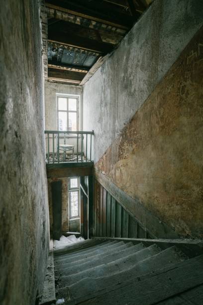 istock gloomy staircase in an abandoned building 1488464901