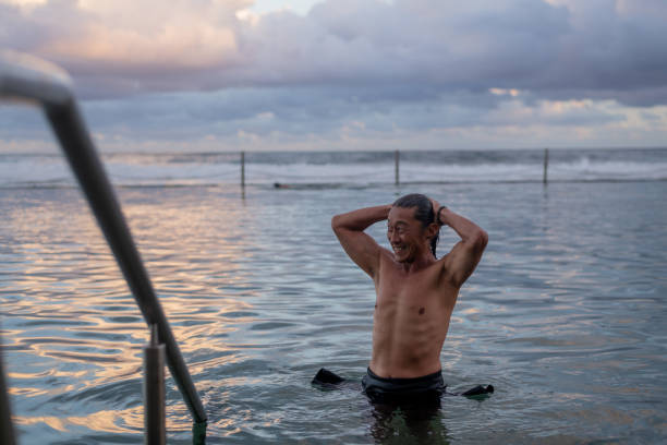 istock A retired male swimming in a rock pool during  sunset 1488466821