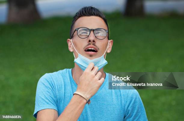 Young Man Having Difficulties To Breath Stock Photo - Download Image Now - B117 - COVID-19 Variant, Males, 20-29 Years