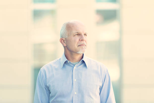 istock Distant portrait of a man looking far away. 1488468247