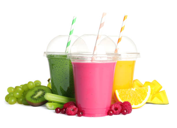 istock Plastic cups with delicious smoothies and ingredients on white background 1488468840