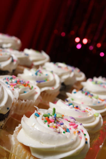 istock Cupcakes with Sprinkles on Table at Birthday Party 1488469236