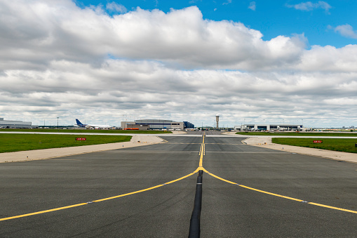 Detroit, Michigan, USA - May 31, 2013: Detroit Metropolitan Wayne County Airport  (Detroit Metro, IATA: DTW) is one of the major national and international hubs of Delta Airlines. The Edward H. McNamara terminal, which also used to be called the Northwest WorldGateway before the acquisition of Northwest Airlines by Delta, opened in 2002 as part of a major overhaul of the aging terminal infrastructure.